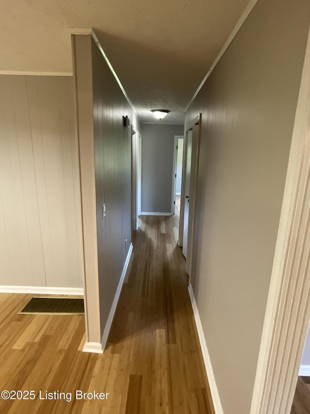 117 Northridge Dr, Bedford, KY 40006 - hall with wood finished floors, ornamental molding, and baseboards