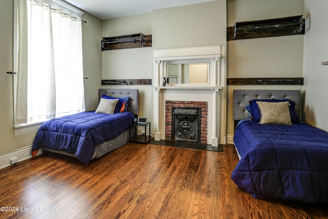 2935 S 3rd St, Louisville, KY 40208 - bedroom featuring wood finished floors and a brick fireplace