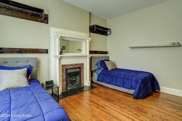 2935 S 3rd St, Louisville, KY 40208 - bedroom featuring wood finished floors, a fireplace, and baseboards