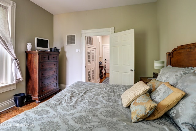 2935 S 3rd St, Louisville, KY 40208 - bedroom featuring wood finished floors and baseboards