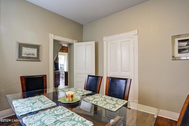 2935 S 3rd St, Louisville, KY 40208 - dining space with baseboards and wood finished floors