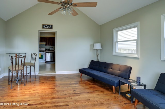 2935 S 3rd St, Louisville, KY 40208 - living room featuring vaulted ceiling, a ceiling fan, wood finished floors, and baseboards