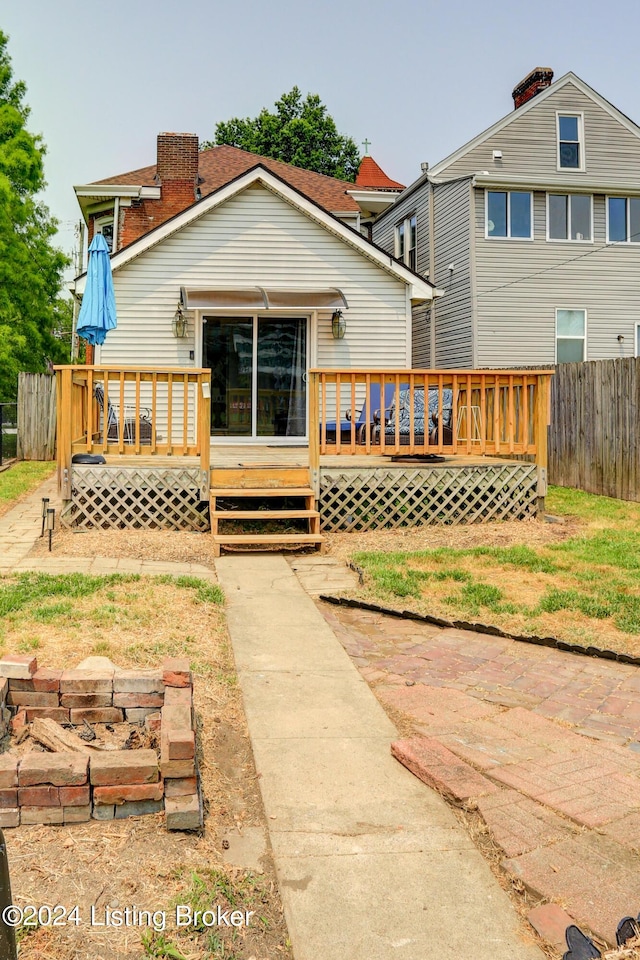 2935 S 3rd St, Louisville, KY 40208 - rear view of property with fence, a chimney, and a deck