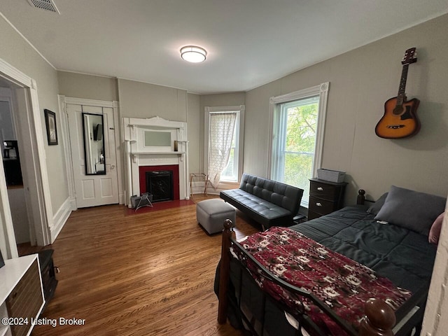 2935 S 3rd St, Louisville, KY 40208 - bedroom with wood finished floors and a fireplace with flush hearth
