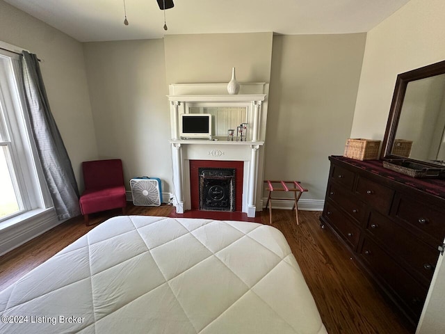 2935 S 3rd St, Louisville, KY 40208 - bedroom with wood finished floors, a fireplace, and baseboards