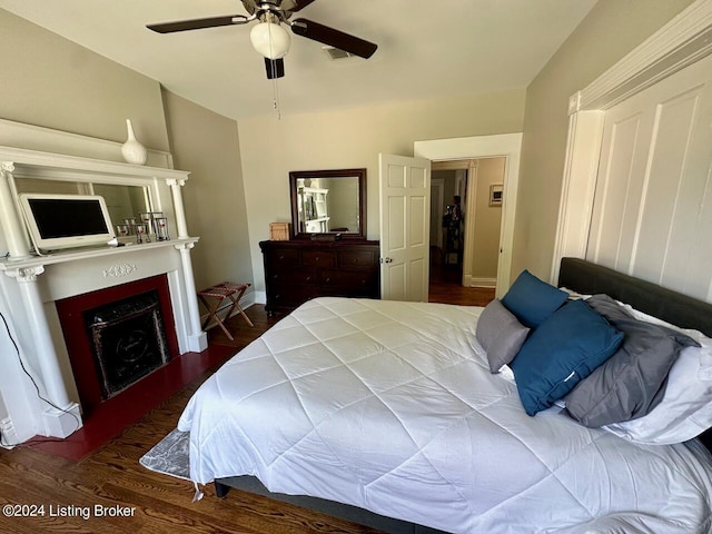 2935 S 3rd St, Louisville, KY 40208 - bedroom with a fireplace, wood finished floors, baseboards, and ceiling fan
