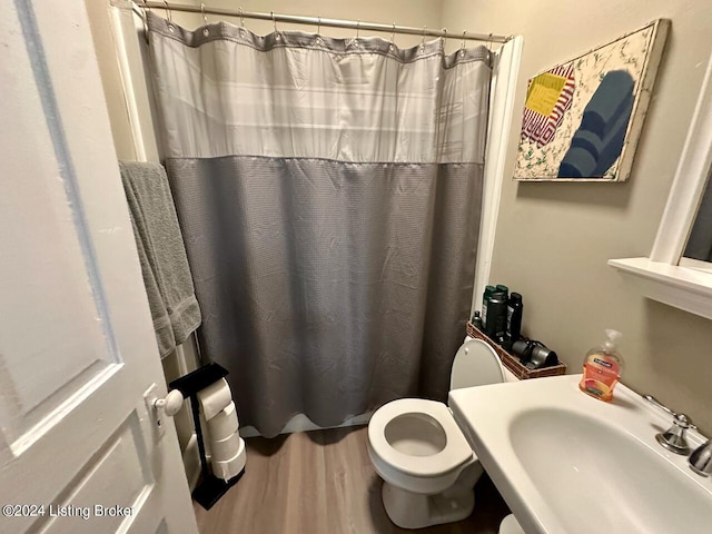 2935 S 3rd St, Louisville, KY 40208 - full bathroom with a sink, wood finished floors, toilet, and a shower with shower curtain