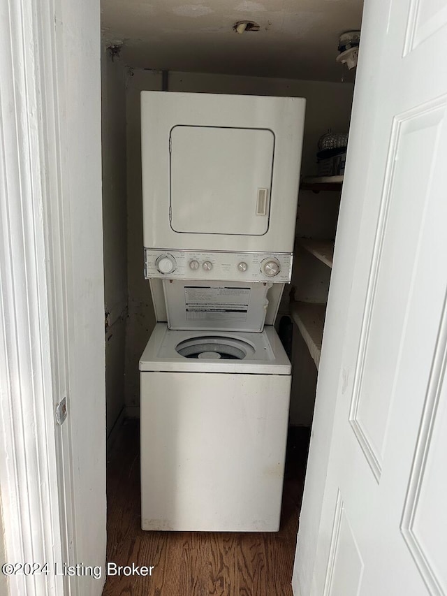 2935 S 3rd St, Louisville, KY 40208 - clothes washing area featuring stacked washer / dryer and wood finished floors