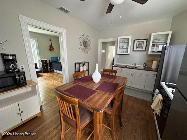 2935 S 3rd St, Louisville, KY 40208 - dining space with ceiling fan and dark wood-style floors