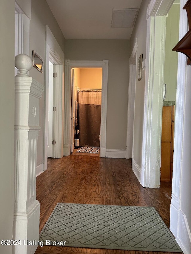 2935 S 3rd St, Louisville, KY 40208 - corridor with wood finished floors, baseboards, and ornate columns