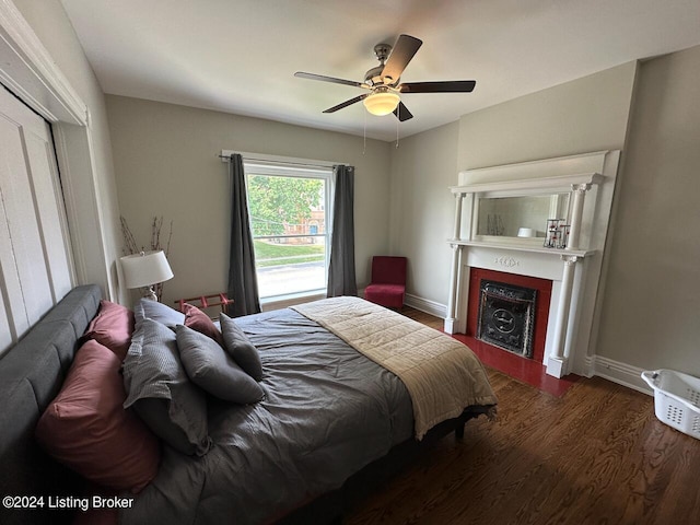 2935 S 3rd St, Louisville, KY 40208 - bedroom featuring wood finished floors, a fireplace, a ceiling fan, and baseboards