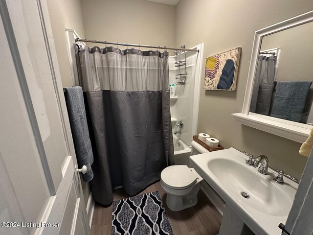 2935 S 3rd St, Louisville, KY 40208 - bathroom featuring wood finished floors, toilet, shower / bath combo, and a sink