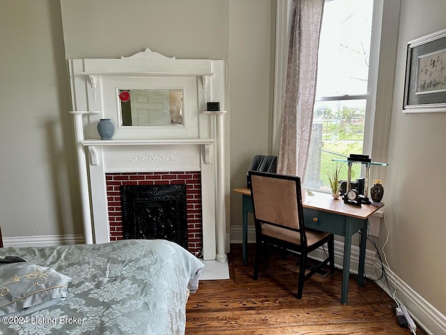 2935 S 3rd St, Louisville, KY 40208 - bedroom with wood finished floors, a fireplace, and a desk