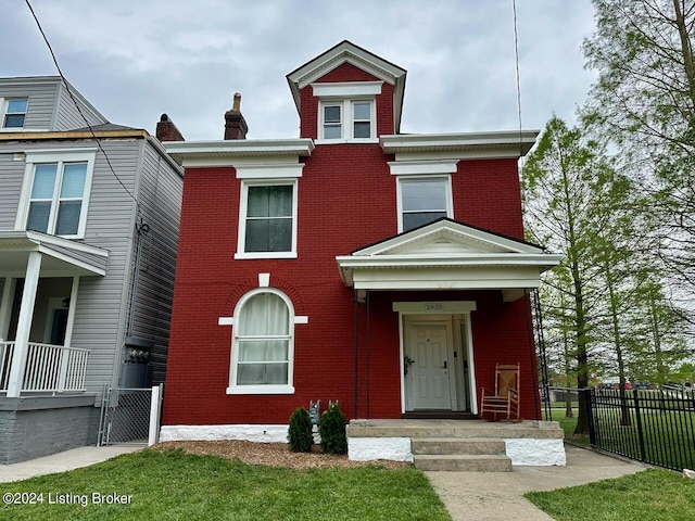 2935 S 3rd St, Louisville, KY 40208 - view of front of home with brick siding, fence, and a gate