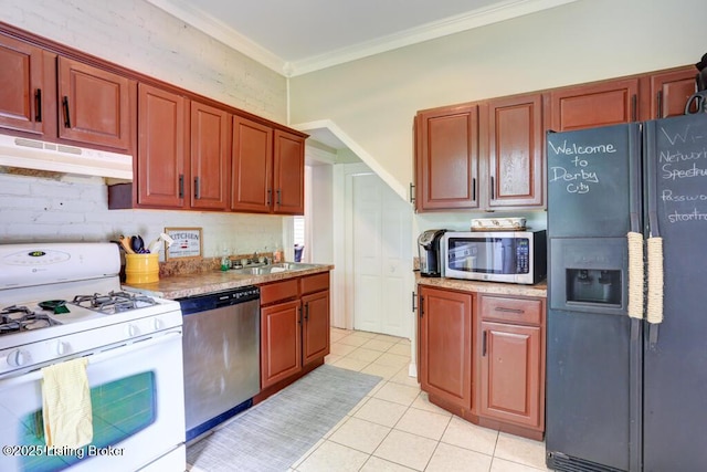 2935 S 3rd St, Louisville, KY 40208 - kitchen with appliances with stainless steel finishes, under cabinet range hood, a sink, ornamental molding, and light tile patterned flooring