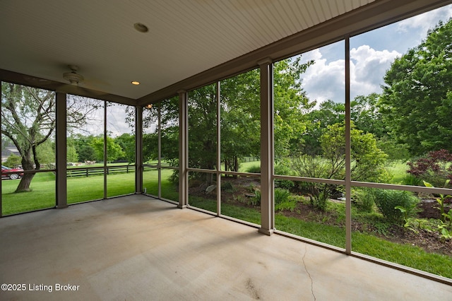 2913 Harrods Crossing Blvd, Crestwood, KY 40014 - unfurnished sunroom with a ceiling fan, view of wooded area, and healthy amount of natural light