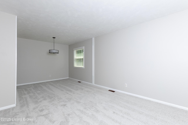 3553 Terrier Ln, Louisville, KY 40218 - spare room featuring baseboards and light colored carpet
