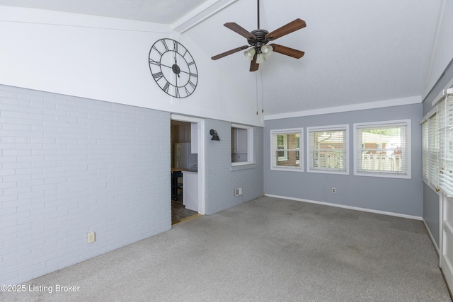 3553 Terrier Ln, Louisville, KY 40218 - carpeted empty room featuring ceiling fan, brick wall, beam ceiling, high vaulted ceiling, and baseboards
