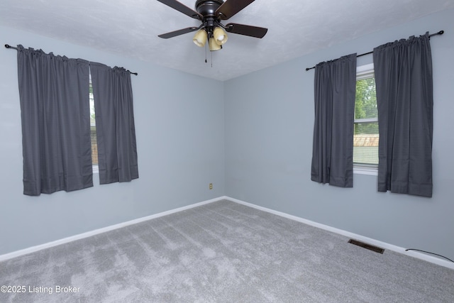 3553 Terrier Ln, Louisville, KY 40218 - carpeted spare room with baseboards and a ceiling fan