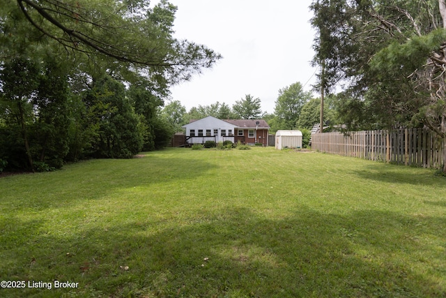 3553 Terrier Ln, Louisville, KY 40218 - view of yard featuring a storage unit, an outdoor structure, and a wooden deck