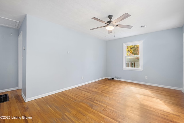 403 Village Dr, Elizabethtown, KY 42701 - empty room featuring attic access, light wood-style flooring, a ceiling fan, and baseboards