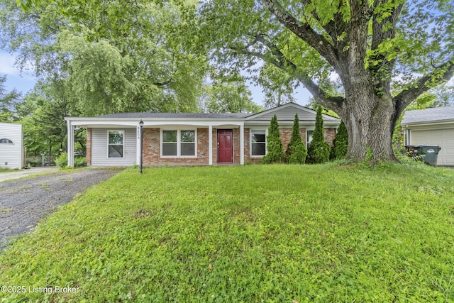 9201 Walhampton Ct, Louisville, KY 40242 - view of front of property with brick siding, a front lawn, and driveway