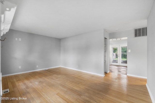 9201 Walhampton Ct, Louisville, KY 40242 - empty room with light wood-style floors, baseboards, french doors, and built in features