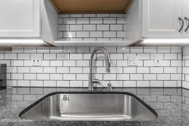 9201 Walhampton Ct, Louisville, KY 40242 - kitchen view of a sink, white cabinets, dark stone counters, and tasteful backsplash