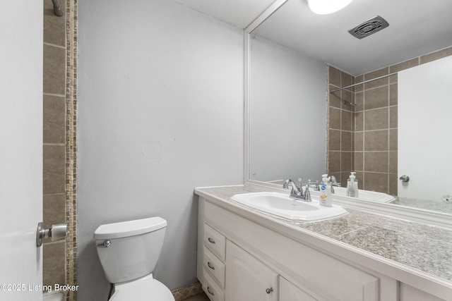 9201 Walhampton Ct, Louisville, KY 40242 - bathroom featuring toilet, vanity, and tiled shower