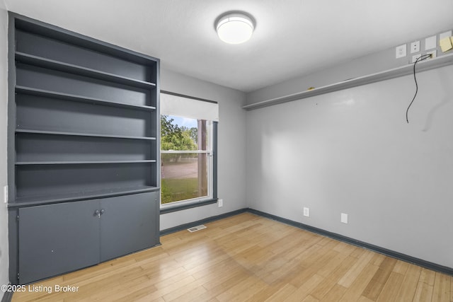 9201 Walhampton Ct, Louisville, KY 40242 - unfurnished bedroom with wood finished floors and baseboards