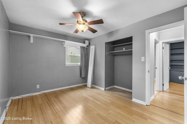 9201 Walhampton Ct, Louisville, KY 40242 - unfurnished bedroom featuring wood finished floors, a ceiling fan, baseboards, and a closet
