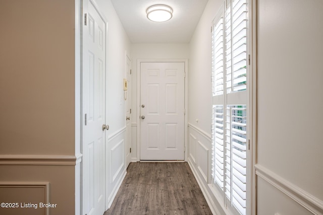 3809 Chamberlain Ln Unit C, Louisville, KY 40241 - doorway with a decorative wall, dark wood-style floors, and wainscoting