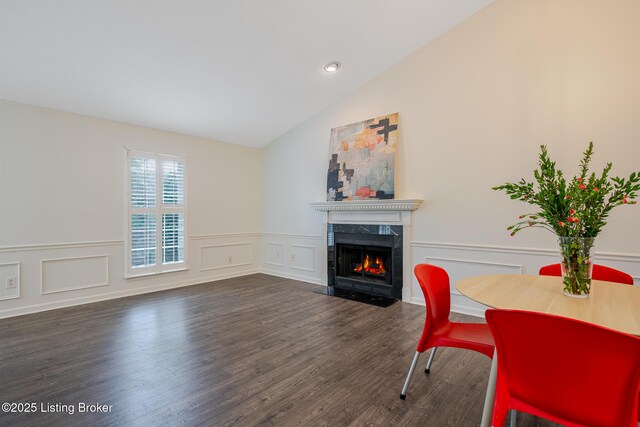 3809 Chamberlain Ln Unit C, Louisville, KY 40241 - dining room featuring a fireplace, a decorative wall, vaulted ceiling, wood finished floors, and wainscoting