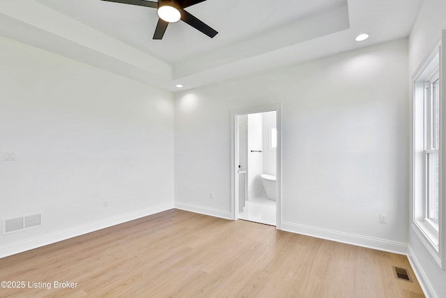 449 S Stallard Dr, Shelbyville, KY 40065 - unfurnished bedroom with recessed lighting, light wood-style floors, baseboards, ensuite bath, and a tray ceiling