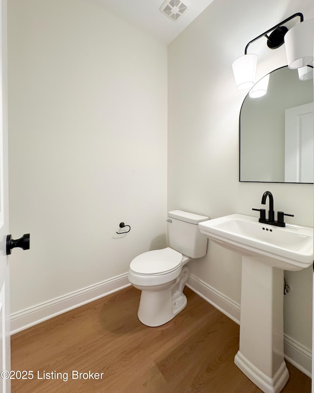 449 S Stallard Dr, Shelbyville, KY 40065 - bathroom featuring baseboards, wood finished floors, and toilet