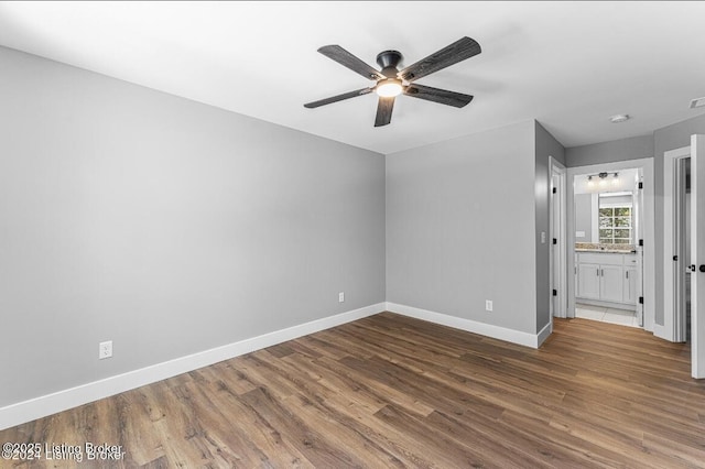 114 N Elm Grove Ave, Bardstown, KY 40004 - empty room with a ceiling fan, wood finished floors, and baseboards
