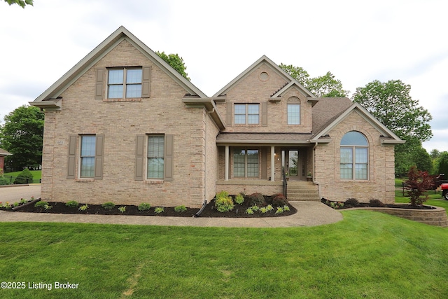 6211 Perrin, Crestwood, KY 40014 - view of front facade featuring covered porch, a front yard, and brick siding