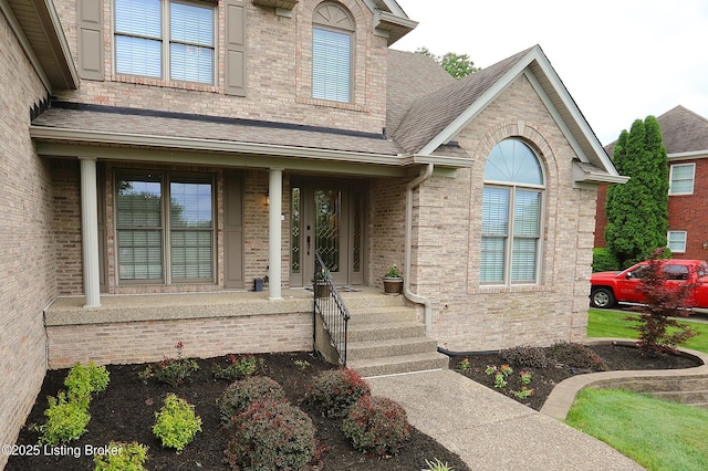 6211 Perrin, Crestwood, KY 40014 - entrance to property featuring a porch, roof with shingles, and brick siding