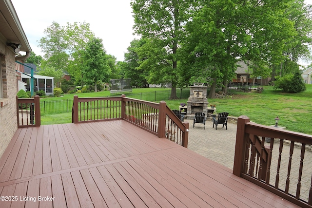 6211 Perrin, Crestwood, KY 40014 - wooden deck with an outdoor stone fireplace, a trampoline, and a patio
