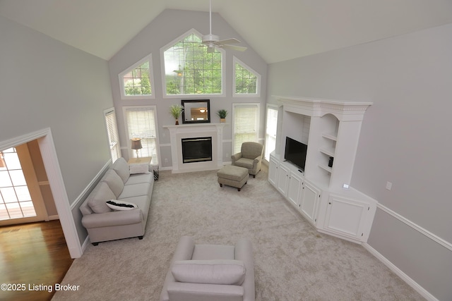 6211 Perrin, Crestwood, KY 40014 - living area with a glass covered fireplace, high vaulted ceiling, plenty of natural light, and light carpet