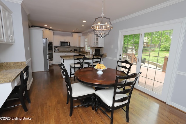 6211 Perrin, Crestwood, KY 40014 - dining space with a chandelier, dark wood-type flooring, ornamental molding, and recessed lighting