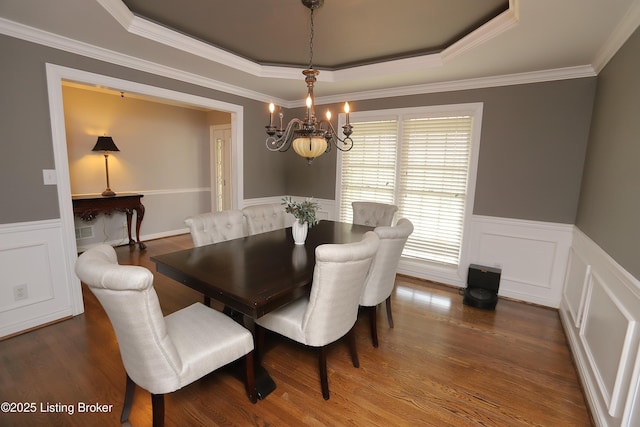 6211 Perrin, Crestwood, KY 40014 - dining room with a chandelier, a tray ceiling, a wainscoted wall, wood finished floors, and crown molding