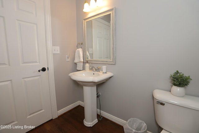 6211 Perrin, Crestwood, KY 40014 - half bathroom featuring wood finished floors, baseboards, toilet, and a sink