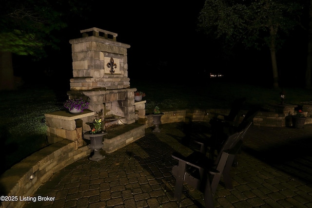 6211 Perrin, Crestwood, KY 40014 - patio at twilight featuring a fireplace