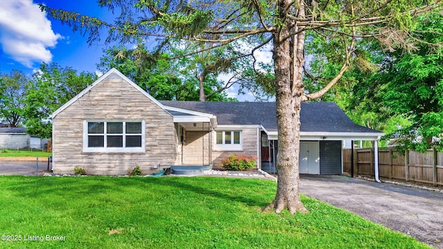 ranch-style house featuring asphalt driveway, a shingled roof, and stone siding