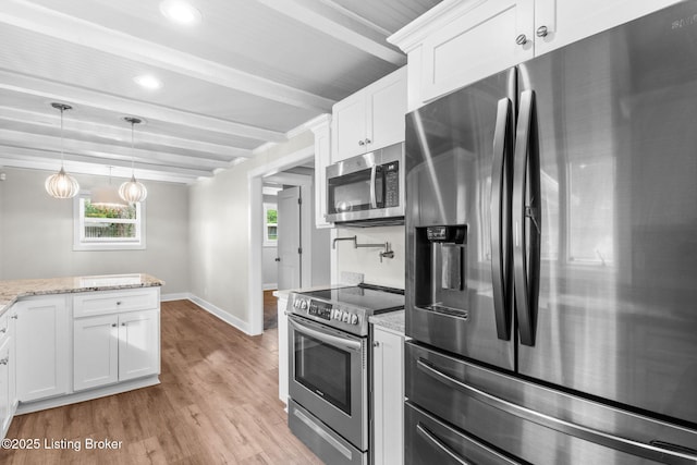 kitchen featuring stainless steel appliances, beam ceiling, baseboards, light wood finished floors, and white cabinetry