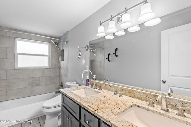 full bath featuring toilet, shower / tub combination, and double vanity