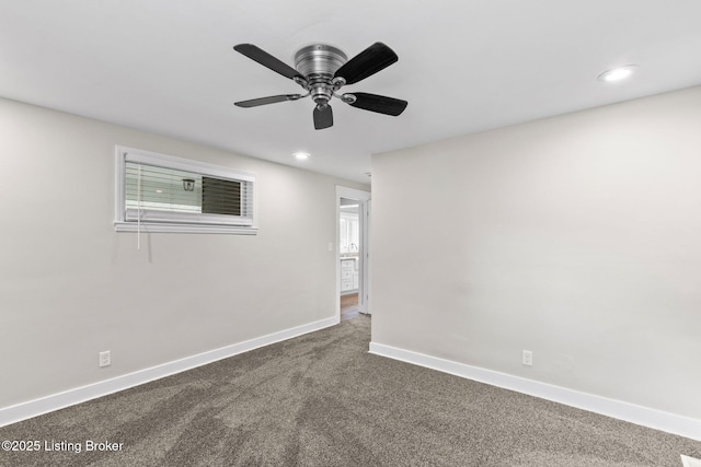 spare room featuring dark colored carpet, baseboards, recessed lighting, and ceiling fan