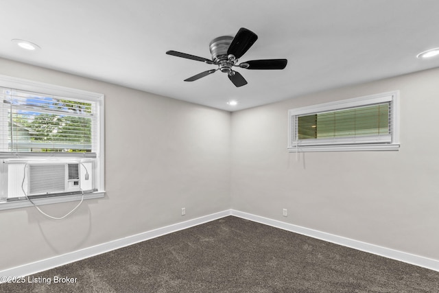 empty room featuring baseboards, cooling unit, ceiling fan, dark colored carpet, and recessed lighting