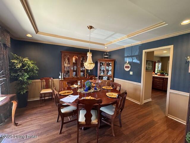 10606 Black Iron Rd, Louisville, KY 40291 - dining area with a tray ceiling, wood finished floors, ornamental molding, and baseboards